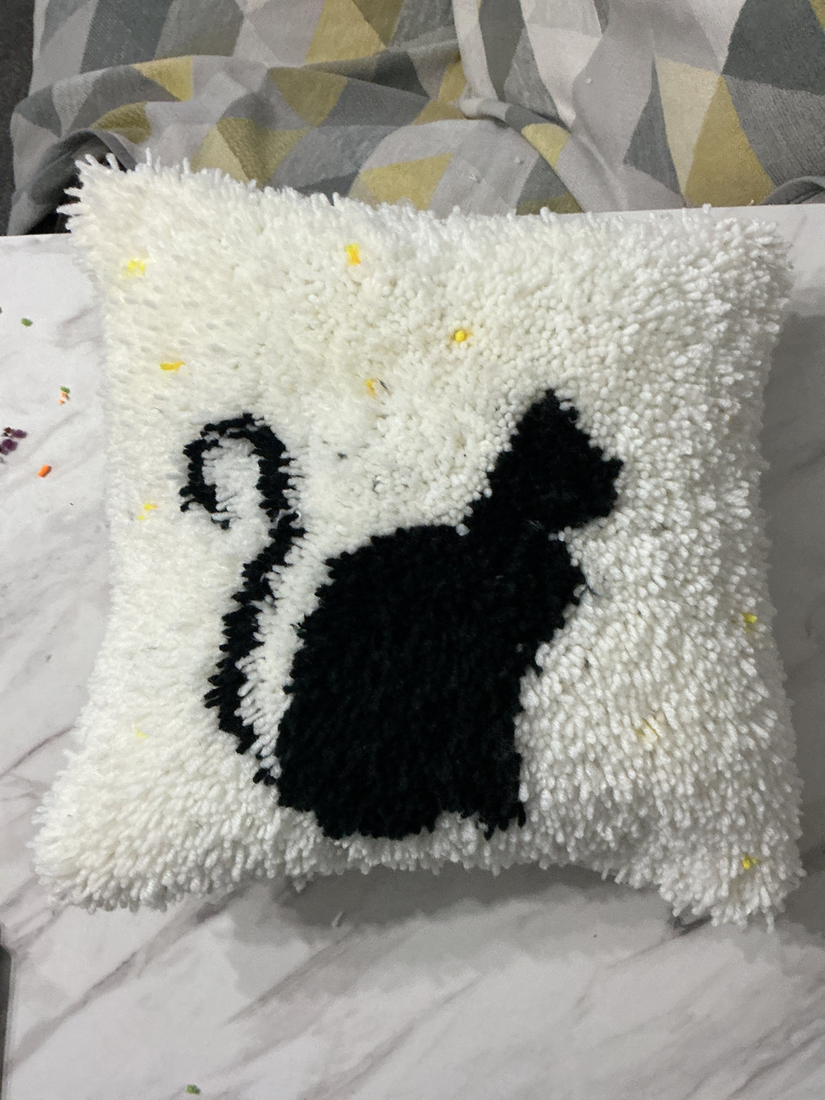 Black cat cushion